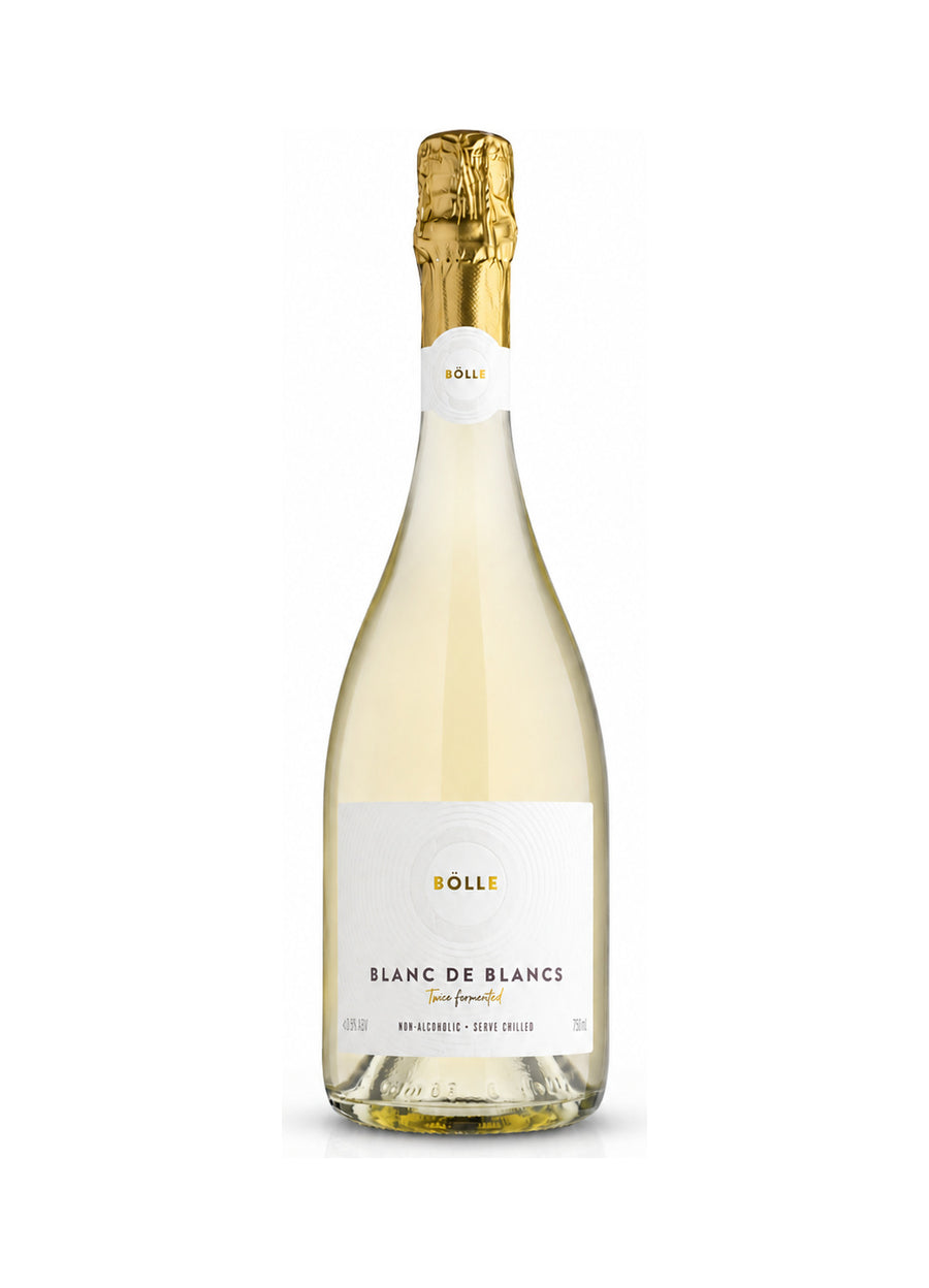 A bottle of Boll Blanc de Blancs non-alcoholic wine, featuring a pale golden-cream liquid, a white label with gold and black text, and a gold foil-wrapped neck, set against a plain white background.
